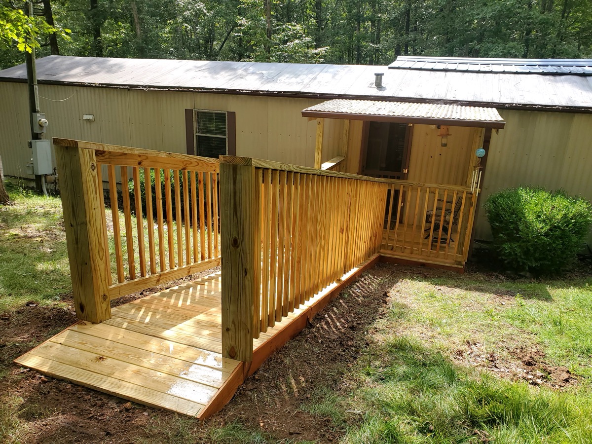Custom wood accessibility ramp with railing